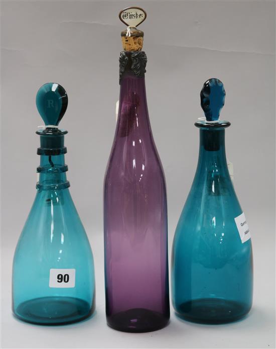 Two Georgian green glass decanters and a later amethyst glass decanter